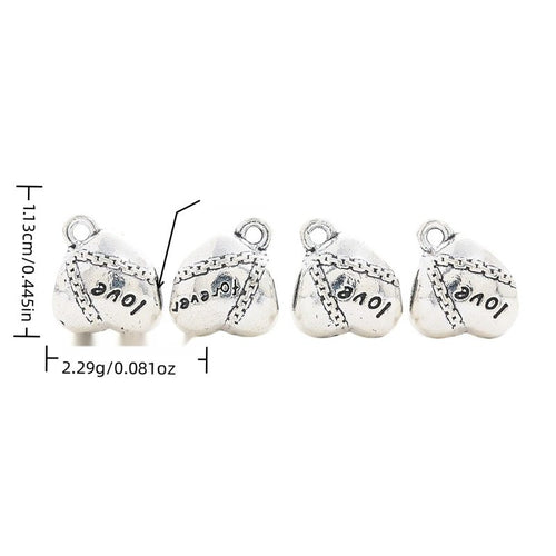 Heart-shaped large-hole bead engraved with love-themed lettering shown in arranged finish comparison