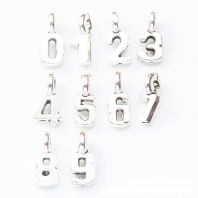 Number metal component, grouped front view on white