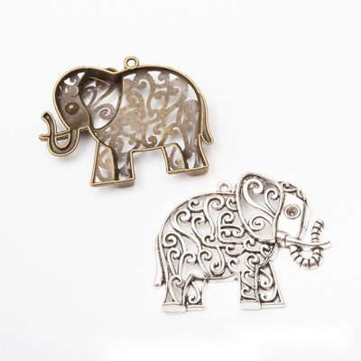 Front comparison of openwork floral elephant metal component in 2 finishes