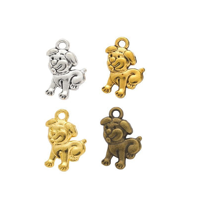 Assorted zodiac dog charms arranged together on a white background
