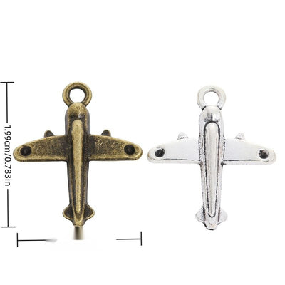 Front-view airplane charms with broad wings and a top loop arranged together on a white background.