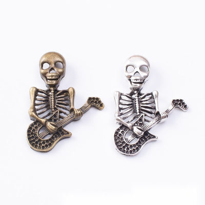 Skeleton Guitar Player metal pieces shown in the available finishes.