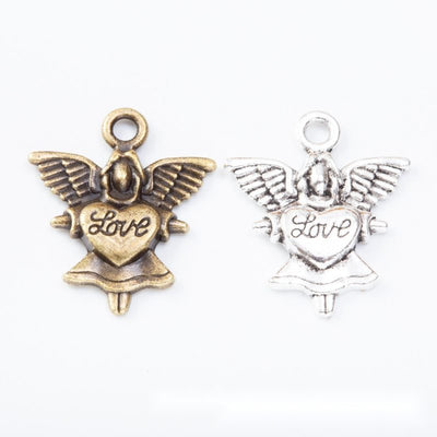 Group view of the angel charm showing the available finishes and front details