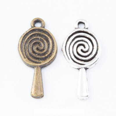 spiral lollipop metal charms in two antique finishes shown together in the available finishes