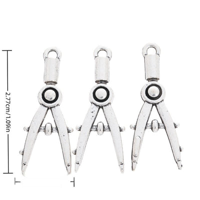 Drawing Compass metal charm displaying front and reverse sides