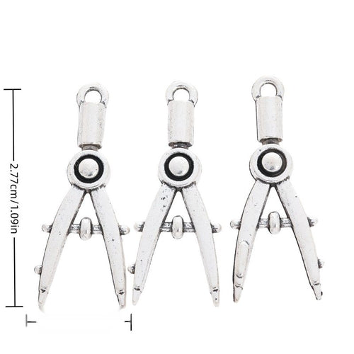 Drawing Compass metal charm displaying front and reverse sides