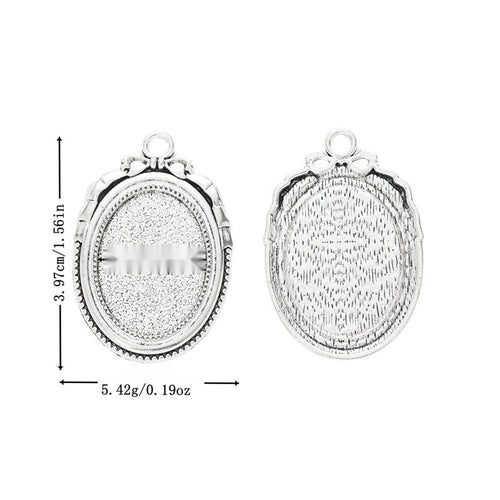 Metal floral-edge oval setting, front and reverse views shown in the product image