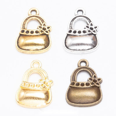 Flower handbag metal component, grouped front view on white