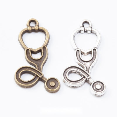 Group view of the stethoscope charm showing the available finishes and front details
