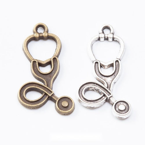 Group view of the stethoscope charm showing the available finishes and front details