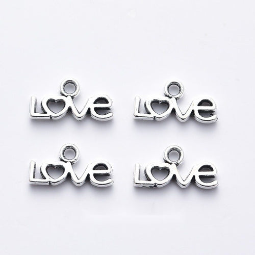 Grouped front views of the small script love word charm in available finishes