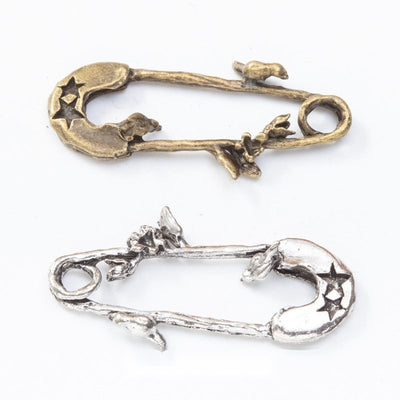 Moon and Stars Safety Pin assortment showing 2 available variants