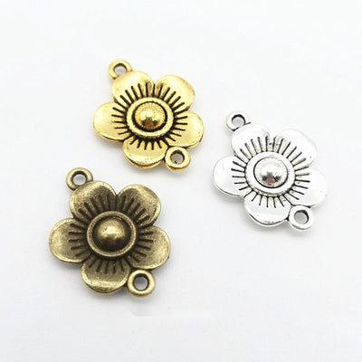 Two-loop layered flower connector shown across the available finishes