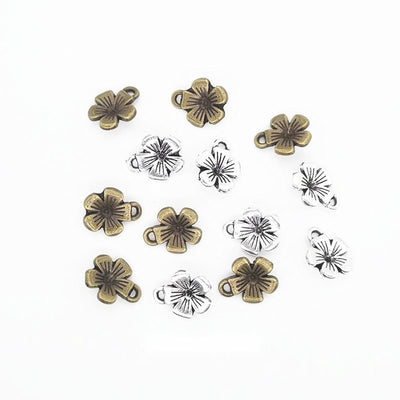 Five Petal Flower Charm Pendant finish comparison showing five grooved petals and a small top loop