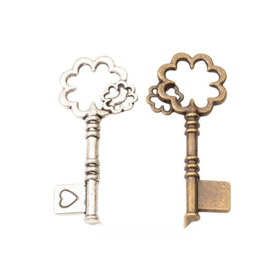 Flower Bow Key Charm finish comparison on a white background