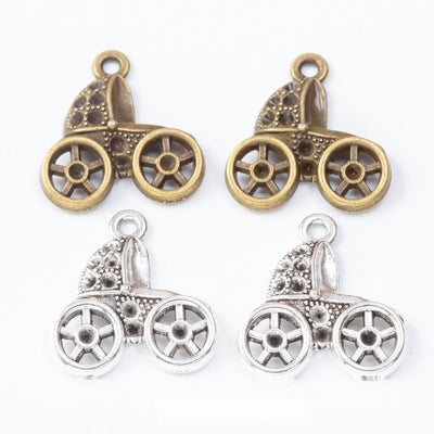 Group view of the baby carriage charm showing the available finishes and front details