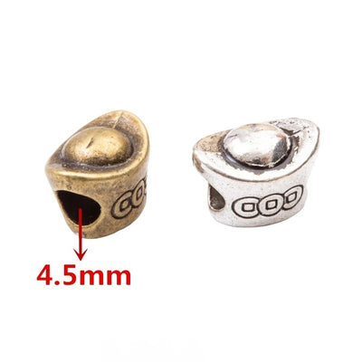 Rounded ingot-shaped bead with a large side hole shown in the available finishes