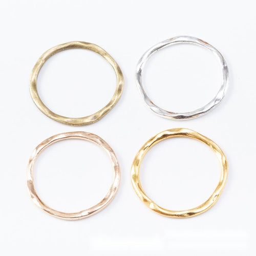 Hammered Round Open Rings in Four Metallic Finishes in multiple metallic finishes displayed together on a white backgrou