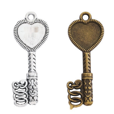 Grouped front view of heart top key charms in the available finishes