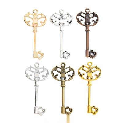 Ornate Heart Bow Key metal pieces shown in the available finishes.