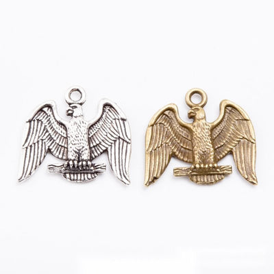 Front and finish comparison of spread-wing eagle charm