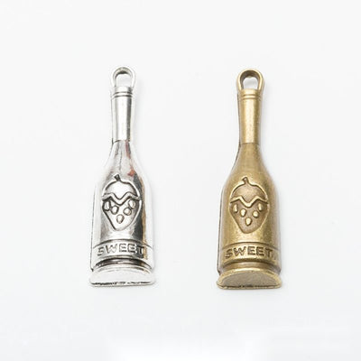 Front and finish comparison of wine bottle charm
