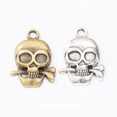 Group view of the skull charm showing the available finishes and front details