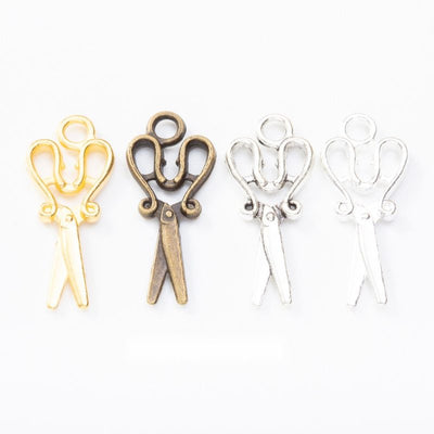 Scissors Metal Charms in Four Metallic Finishes in multiple metallic finishes displayed together on a white background.