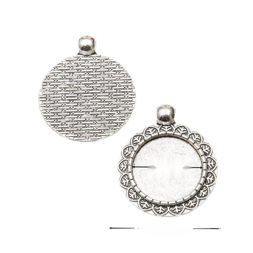 Assorted round cabochon pendant settings arranged together on a white background