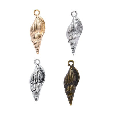 Overview of elongated seashell charm pieces on a white background