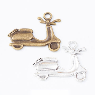 Group view of the scooter charm showing the available finishes and front details