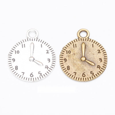 Clock face metal component, grouped front view on white