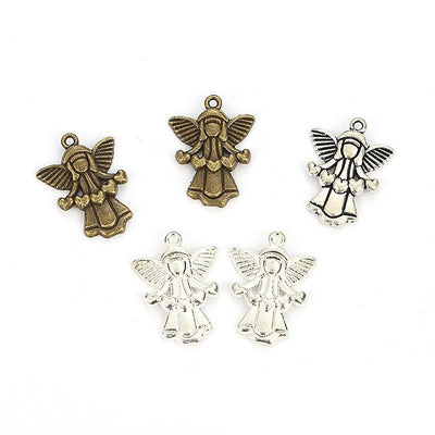 Assorted angel charms arranged together on a white background