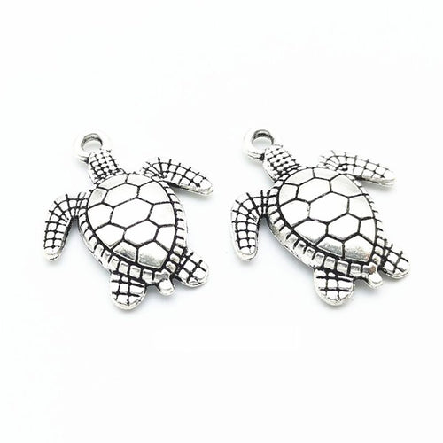 Sea Turtle Charm shown in all pictured finishes on a white background