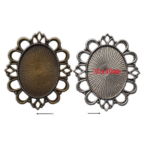 Grouped front views of oval floral bezel settings