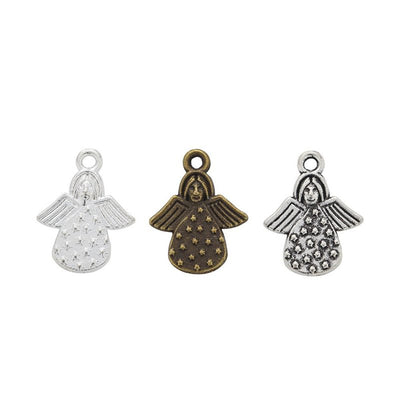 Small angel figure with dotted skirt and engraved reverse text shown in the available finishes