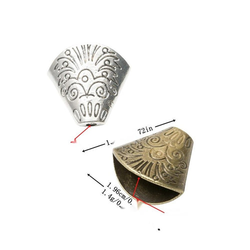 Assorted antique bronze and antique silver engraved conical bead cap pieces on white