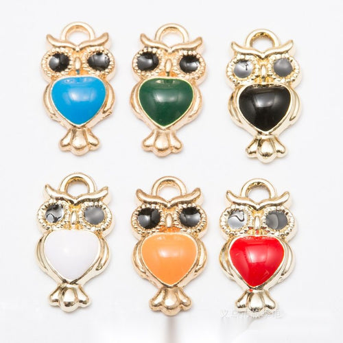 Owl with a colored enamel belly shown across the available colors