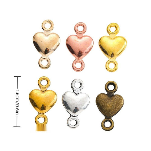 Polished Heart Connector Charm assortment showing the available metal finishes