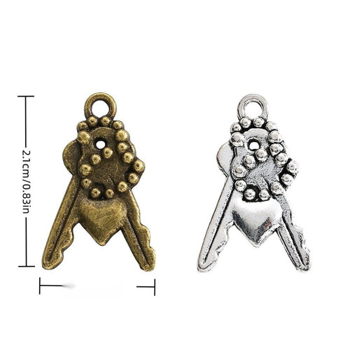 Key Bundle metal charm displaying front and reverse sides