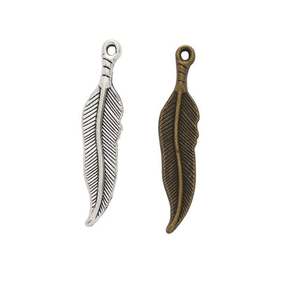 Product view of long feather charm showing a slim curved feather with fine engraved barbs and a round top loop