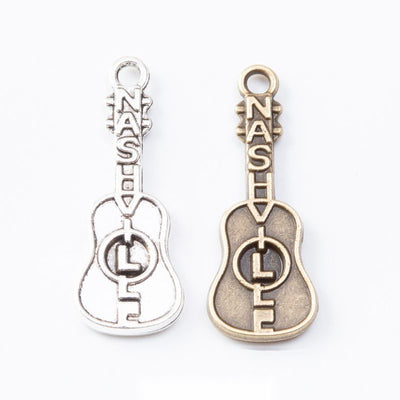 Guitar Music Note Charm finish comparison on a white background