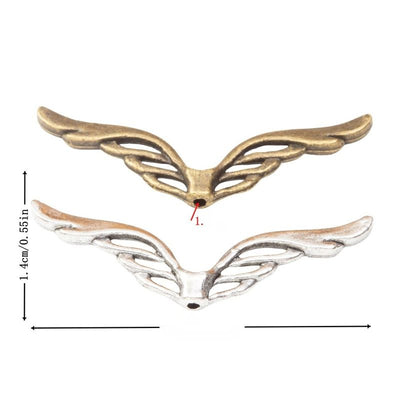 Grouped front view of openwork angel wing spacer beads in the available finishes