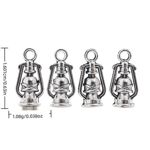 Front display of miniature kerosene lantern charm shown against a plain background.