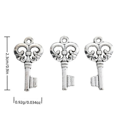 Fleur De Lis Key metal piece shown in Antique Silver beside printed specifications