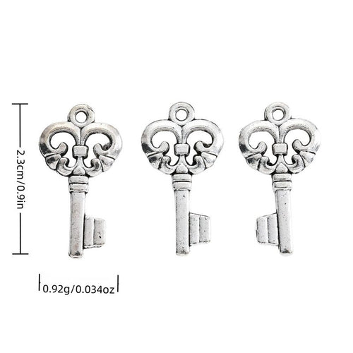 Fleur De Lis Key metal piece shown in Antique Silver beside printed specifications
