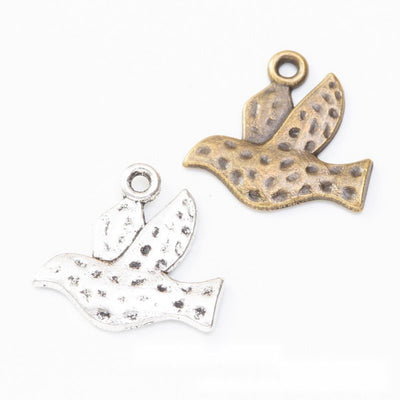Finish comparison of 飞鸟 charm on a white background