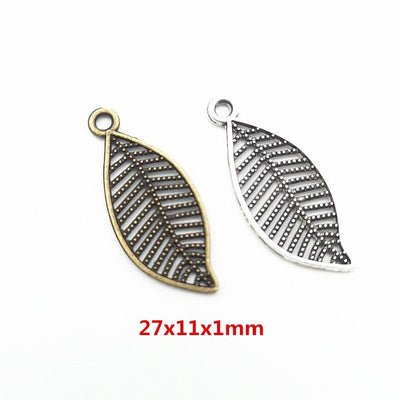 Grouped front views of openwork leaf charms