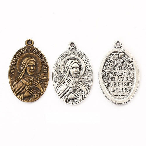 Saint Therese Medal shown on a white background