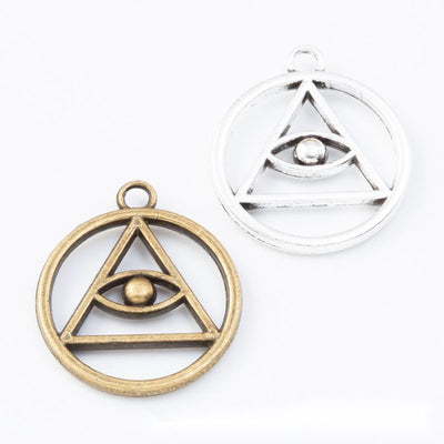Group view of the round triangle eye charm showing the available finishes and front details